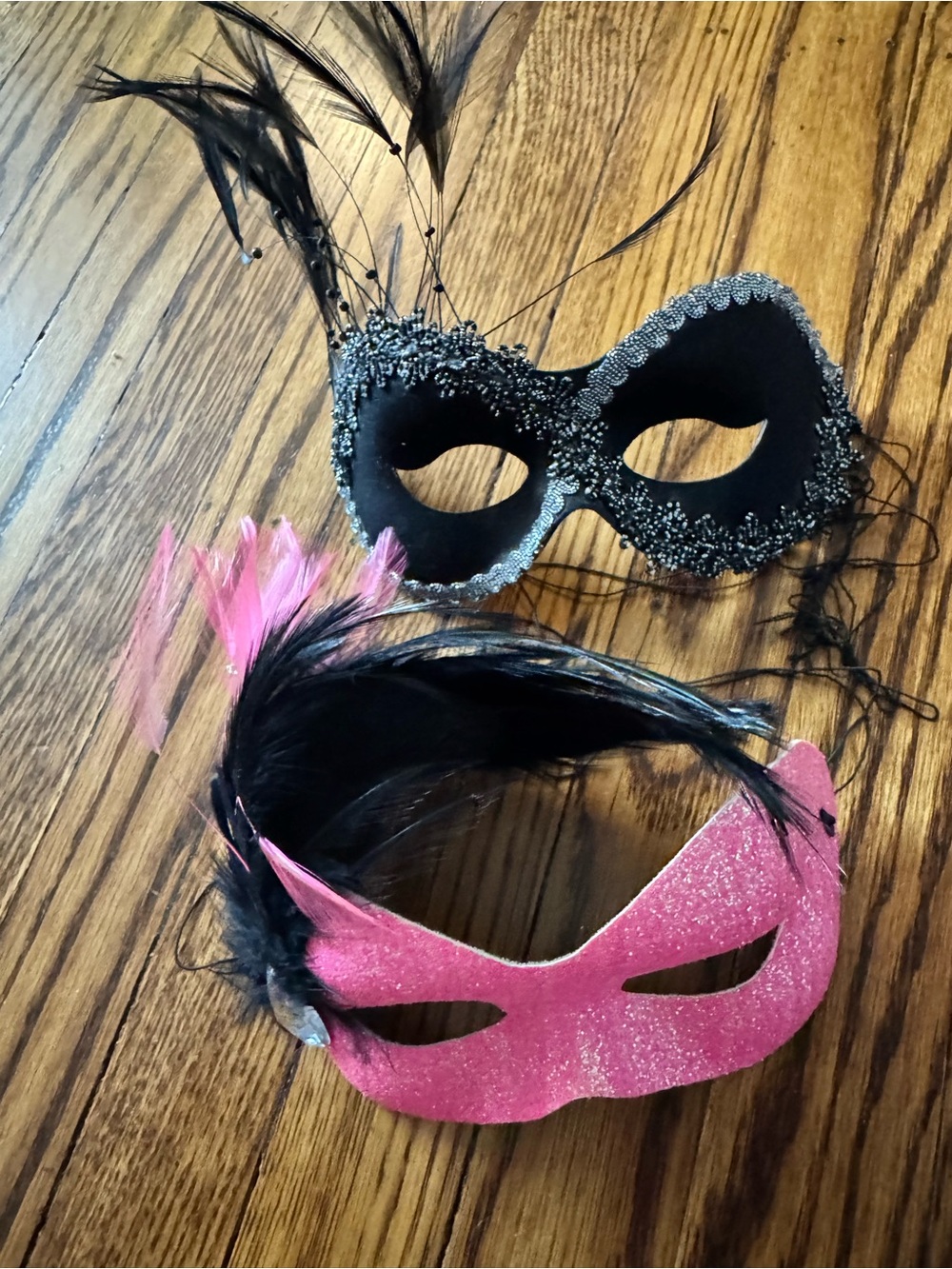 2 masks…. Pink and Black Feathered Woman’s Masquerade Masks - Brand
